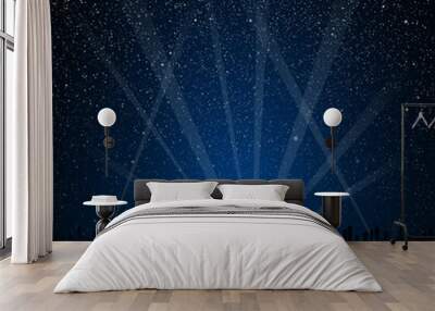 Silhouette of the city. Rays of spotlights. Wall mural