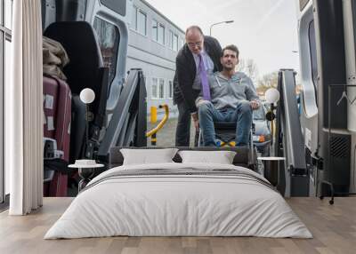 Cab Driver Assisting Disabled Man To Board Wheelchair Lift Van Wall mural