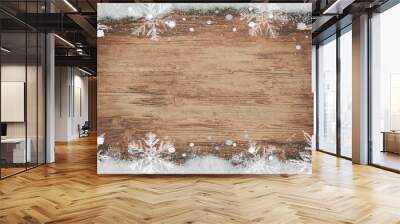 winter / Advent / christmas Background template - Frame made of snow with snowflakes and ice crystals on brown wooden texture, top view with space for text Wall mural