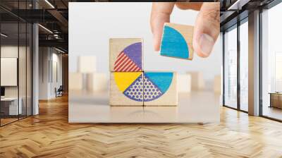 Market share, business opportunity, market growth, increase market share or business concept. Businessman grabs a piece of wooden blocks with pie chart graphic. Wall mural