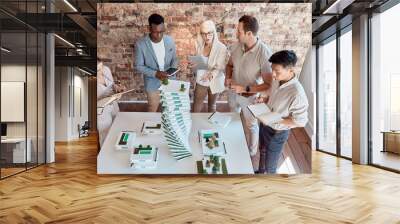 People, building model and architecture planning in office for innovation, urban development and environment aware design. Engineer team, discussion and 3D structure in firm for property construction Wall mural