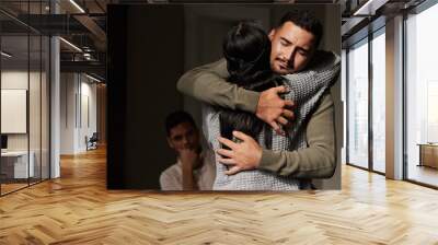 Hug, support and crying man embrace for comfort, grief and care after bad news or problems in a home or house. Cancer, sad and depression by people hugging for empathy, love and hope together Wall mural