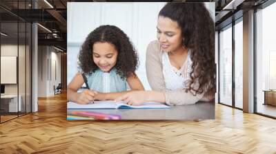 She loves homeschool. Shot of a mother helping her daughter with homework at the kitchen table. Wall mural