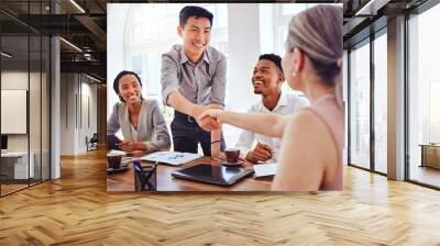 Handshake, meeting and business people happy with welcome to a corporate marketing company at work. Employees shaking hands for partnership deal, client collaboration and team support in an office Wall mural