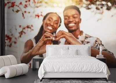 Love, heart and hands with a young couple and a hand gesture to show affection, romance and health. Man and woman showing support, care and trust with a symbol of wellness and a healthy lifestyle Wall mural