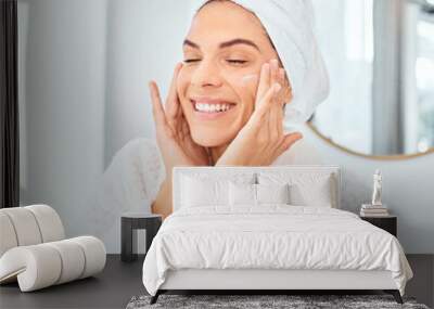 Skincare, smile and woman with face cream in a bathroom for wellness, dermatology and treatment in her home. Facial, lotion and happy female person with sunscreen, cosmetic and collagen beauty cream Wall mural