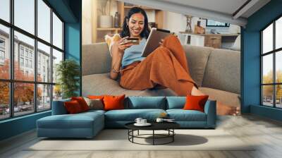 Woman on sofa with tablet, credit card and online shopping of fintech payment on ecommerce at home. Happy female customer in apartment, bank app or sale on store website with digital internet banking Wall mural