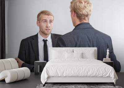 two businessmen standing, discussing Wall mural