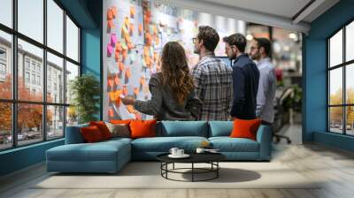 Hard work on startup. A large number of sticky notes on the wall indicate many tasks that need to be completed. The team brainstorming Wall mural