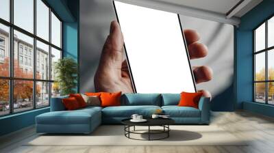 Mockup template for white smartphone in person's hand. Gray wall on background
 Wall mural