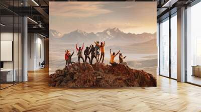 Big group of happy tourists are having fun and greeting sunset at mountain top. Active vacations concept Wall mural