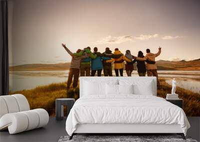 Happy big family hugging together in mountains Wall mural