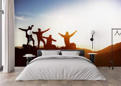 Happy friends at sunset mountains Wall mural