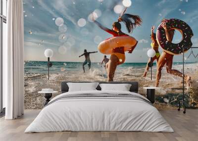 Old style photo of group of friends are having fun and running to sea beach with inflatable donuts Wall mural