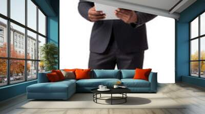 Full length portrait of a smiling African-American businessman holding tablet standing isolate Wall mural