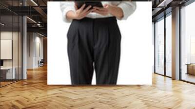 Portrait of a smiling business woman holding tablet and standing on isolate background Wall mural