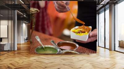 Indian curry rice with sauces at a street market Wall mural