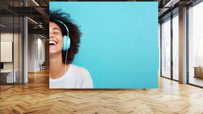 Generative AI illustration of smiling woman listening to music - positive and joyful. Solid color cyan blue background Wall mural