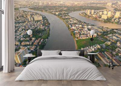 Panoramic view of Saigon, Vietnam from above at Ho Chi Minh City's central business district. Cityscape and many buildings, local houses, bridges, rivers Wall mural