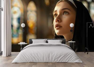 Portrait of a young nun in a church Wall mural