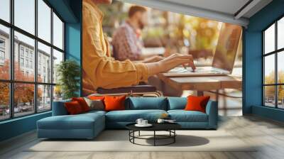 A person with a disability using a laptop with assistive technology, fully engaged in the meeting Wall mural