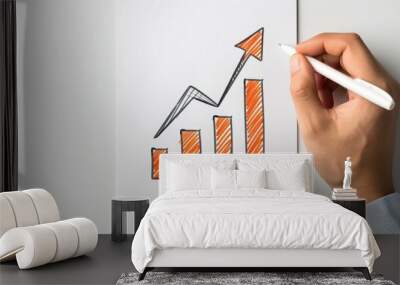 A hand illustrates a figure and an upward trend line, symbolizing growth and strategy in a creative sketch style. Wall mural