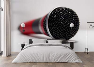 A sleek classic microphone design in silver, black, and red, perfect for any audio enthusiast or studio setting. Wall mural