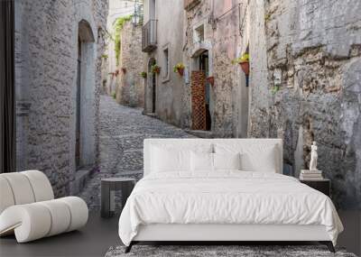 An old medieval town with a narrow curved walking street in Italy Wall mural