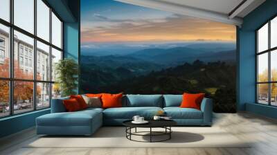 Panoramic mountain sunrise with lush greenery and rolling hills Wall mural