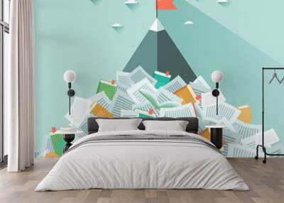 a mountain sticking out from a pile of book and papers. concept of succeeding through hard working a Wall mural