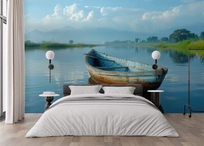 A traditional African fishing boat gliding silently across the still waters of a reflective lake Wall mural