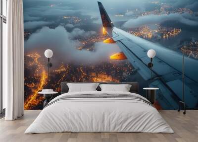 Passenger Aircraft Wing Over City Lights Aerial view of an airplane wing against the backdrop of city lights Wall mural