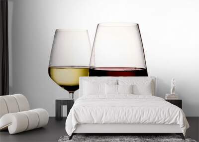 Foreground of two glasses of wine, the first is a glass of red wine, the second is a glass of white wine on a light background Wall mural