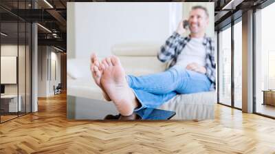 Blurred background of a man talking on a phone Wall mural