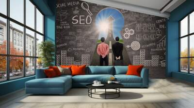 Business partners and SEO doodle on blackboard Wall mural