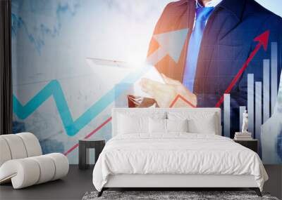 Businessman hands using tablet with upward arrows Wall mural