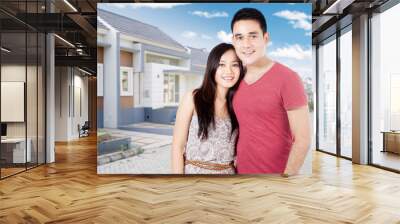 Couple standing near the new home Wall mural