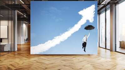 European businessman with umbrella and upward arrow Wall mural