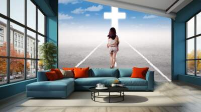 Girl doing a holy trip to the cross Wall mural