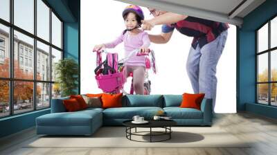 Girl ride bicycle with her father Wall mural