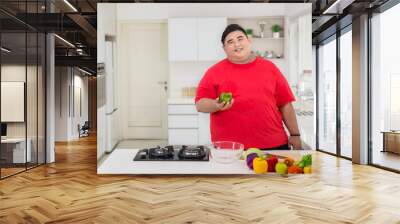 Happy fat man preparing to make a healthy salad Wall mural