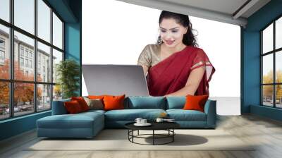 Indian woman using laptop with traditional clothes Wall mural