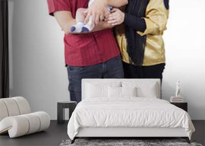 Muslim family with baby in studio Wall mural