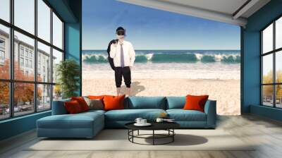 Successful businessman wearing snorkeling on beach Wall mural