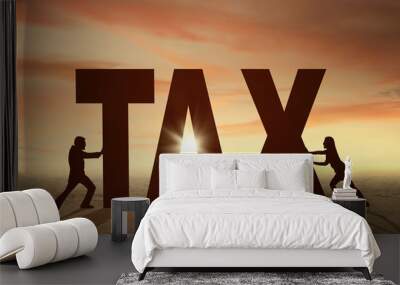 Two workers pushing a tax word Wall mural