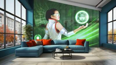 Woman with virtual button and earth graphic Wall mural