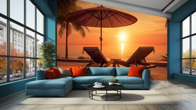 Beautiful Silhouette palm tree umbrella and chair around swimming pool in hotel resort at sunrise Wall mural