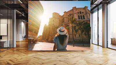 Tourist woman walking in Malaga city at sunset. Summer holiday vacation in Spain Wall mural