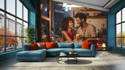 A loving couple enjoying a romantic night out, laughing and cooking together in a cozy home kitchen. Wall mural