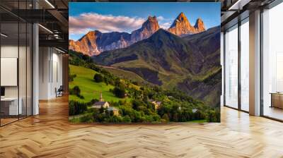 church in a village in the french alps with mountains 3000 meters high. Green meadows in spring Wall mural